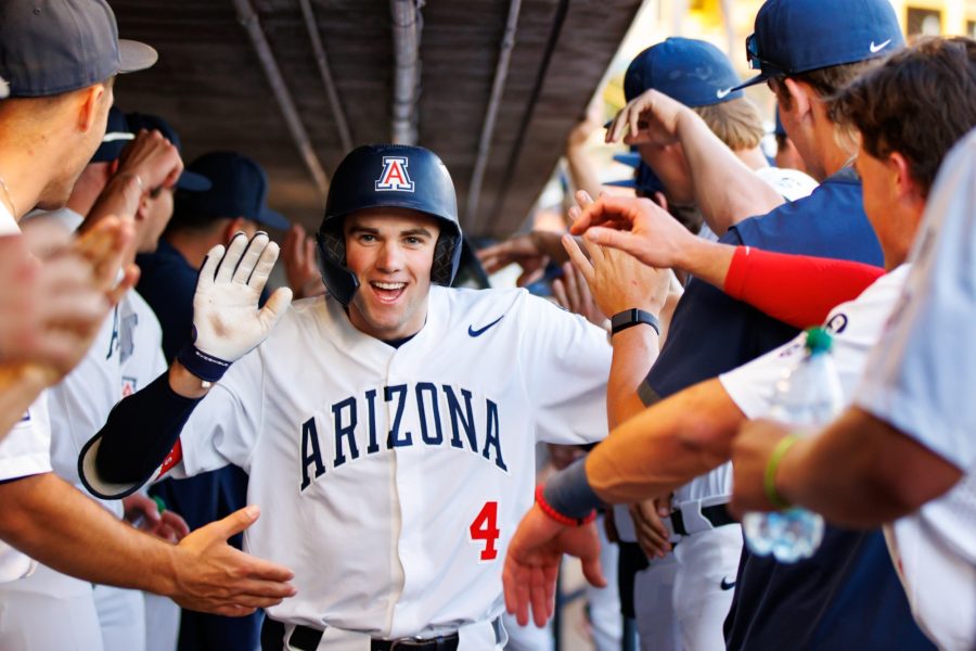 Arizona outfielder Brendan Summerhill returns to the dugout after a home run in a game against New Mexico State University on April 11 at Hi Corbett Field. The Wildcats went on to win the game 14-2. 