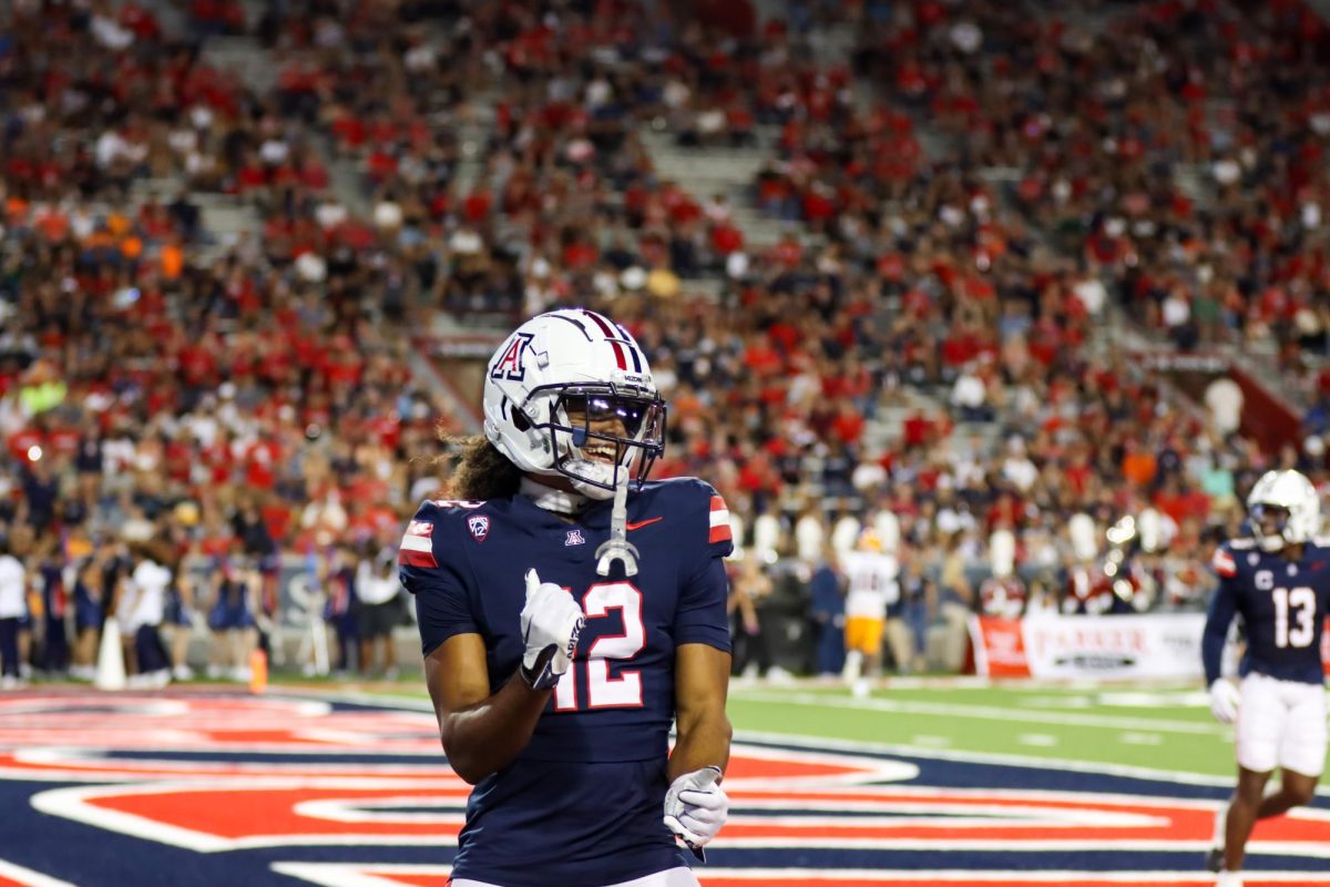 Arizona football safety Genesis Smith (12) celebrates during a game against the University of Texas at El Paso on Saturday, Sept. 16. The Wildcats won the game 31-10.