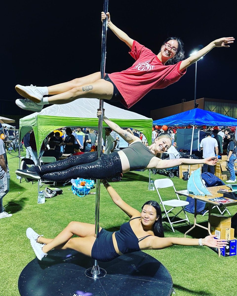 From top, Tatyana Wong, Erika Haws and Dorie Chen from the University of Arizona AZ Pole and Aerial club at Bash at the Rec on Aug. 20 at the Arizona recreation center. AZ Pole and Aerial holds pole and aerial dance classes every Sunday. (Photo courtesy of Alexis Garza.)