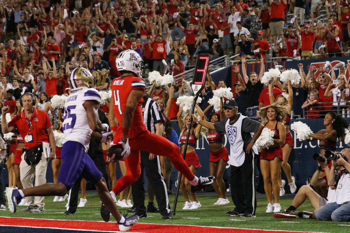 Arizona football wide receiver Tetairoa McMillan (4) catches a touchdown pass from quarterback Noah Fifita. McMillan had two touchdowns in the 31-24 loss to the University of Washington on Saturday, Sept. 30.