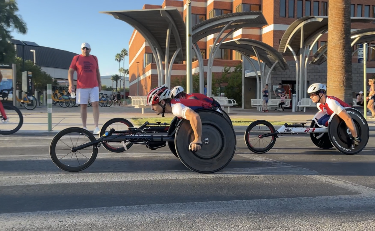 Three+Arizona+Adaptive+Athletics+wheelchair+athletes+race+to+the+finish+line+in+the+first+race+of+the+Jim+Click+Run+%E2%80%98N%E2%80%99+Roll+race+around+the+University+of+Arizona+campus+on+Sunday%2C+Oct.+8.+This+event+is+the+biggest+fundraiser+of+the+year+for+Arizona%E2%80%99s+Adaptive+Athletics+program%2C+which+is+the+largest+and+most+successful+collegiate+adaptive+program+in+the+country.+