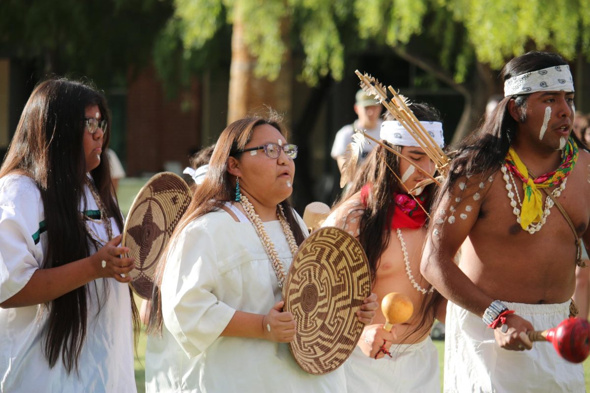 The ChiChino Spirit Oodham Dance Group performs a traditional dance at the Indigenous Peoples Day celebration on the UA Mall on Oct. 9. Kris Dosela leads the dance group.