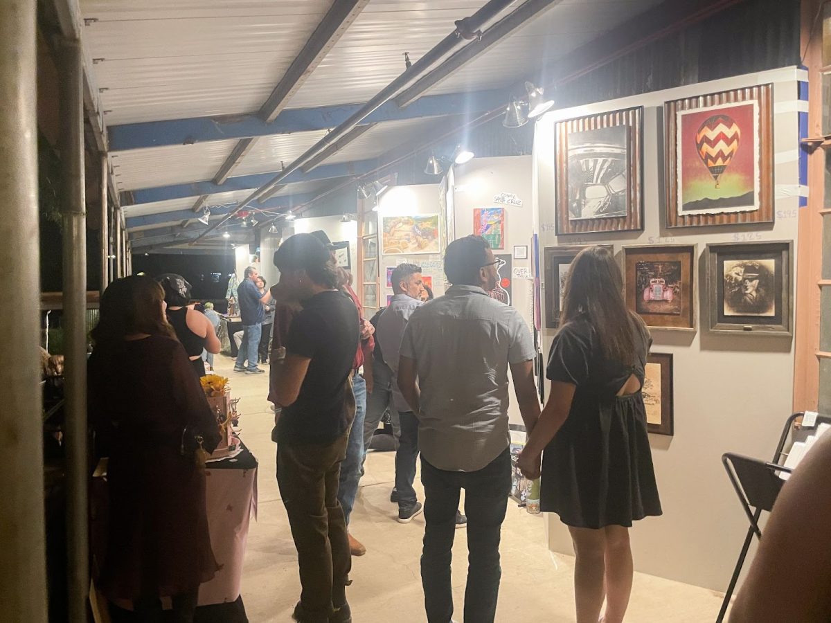 Attendees+at+the+Tucson+Booze+and+Art+Show+on+Oct.+21.+Many+different+types+of+artists+showed+up%2C+from+illustrators%2C+painters%2C+wood+workers+and+more.+