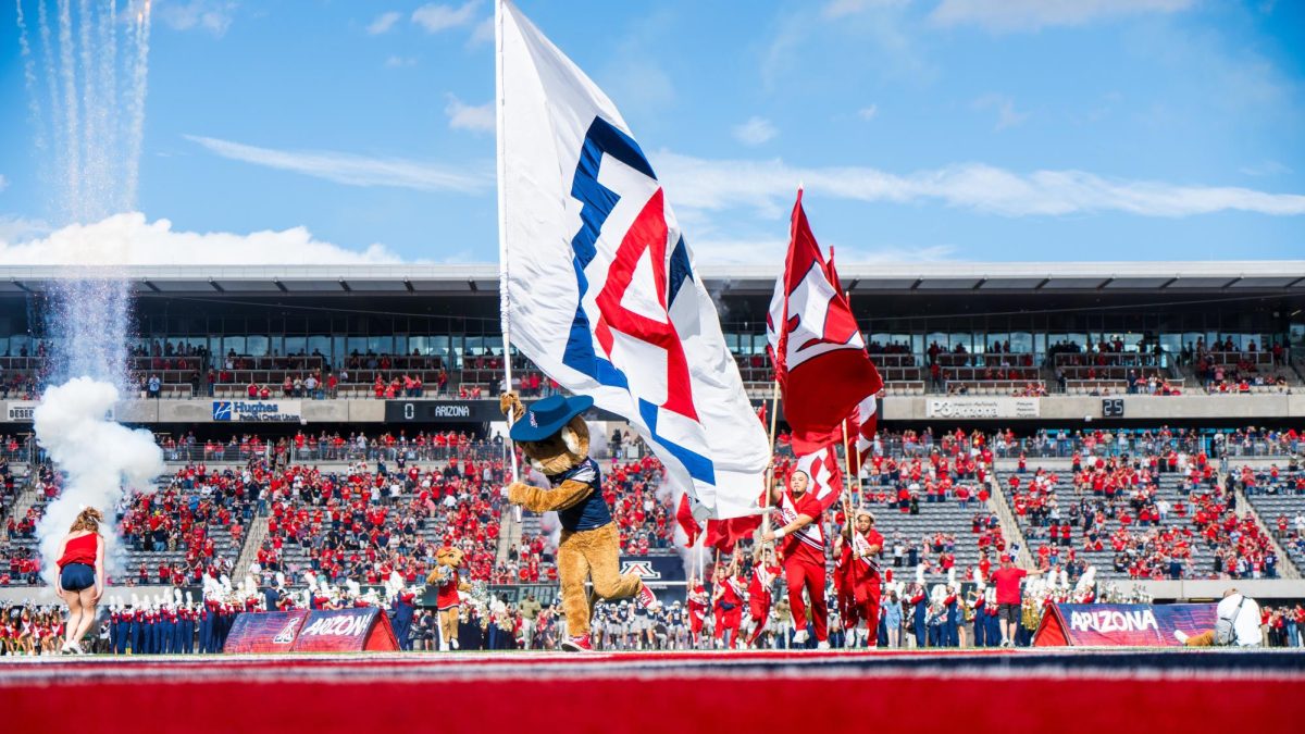 The Arizona football team runs onto the field at Arizona Stadium with fireworks on Saturday, Nov. 18. No. 19 Arizona beat the No. 16 University of Utah 42-18.
