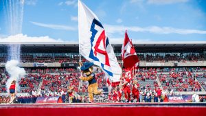 The Arizona football team runs onto the field at Arizona Stadium with fireworks on Saturday, Nov. 18. No. 19 Arizona beat the No. 16 University of Utah 42-18.
