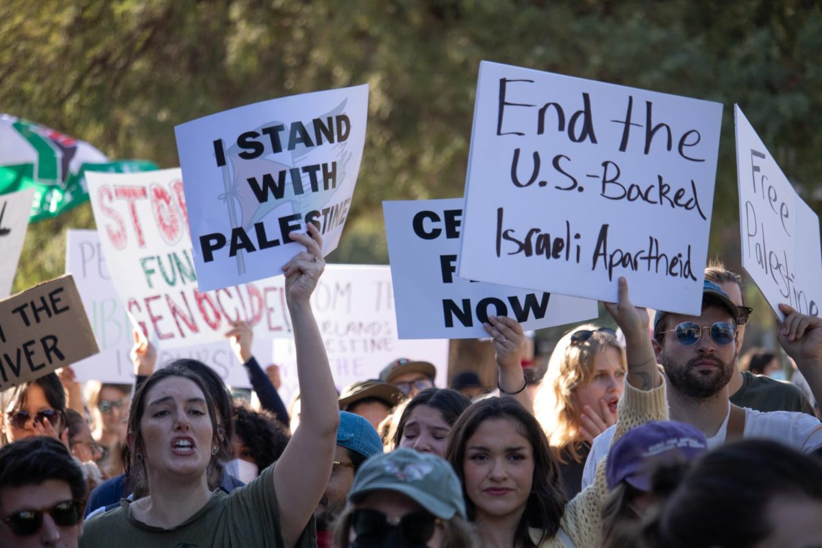 Protestors chant in support of Palestine on the UA campus on Nov. 9 during the Walkout for Palestine. The rally began at Old Main and progressed with a march onto the Mall.
