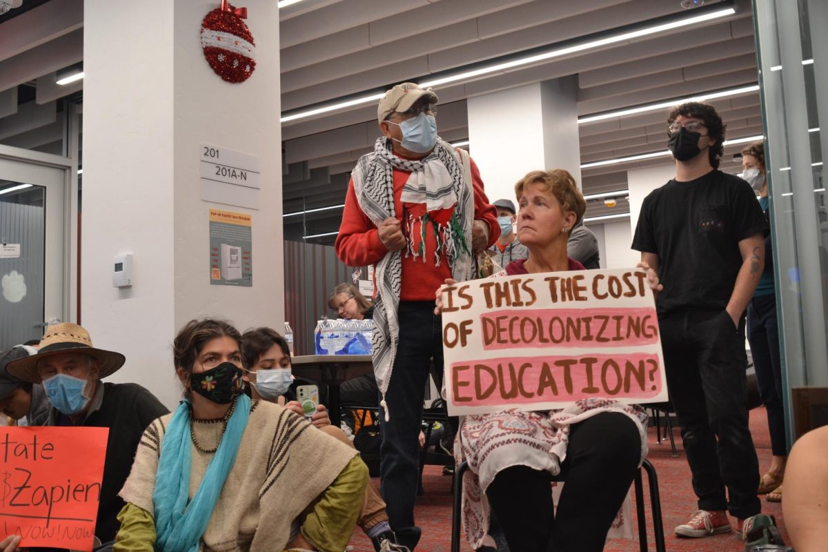 University of Arizona students and community members held a sit-in at the College of Education on Monday to protest the suspension of two university professors. Speakers at the sit-in expressed concern about rights to free speech and the future of open dialogue in college classrooms.