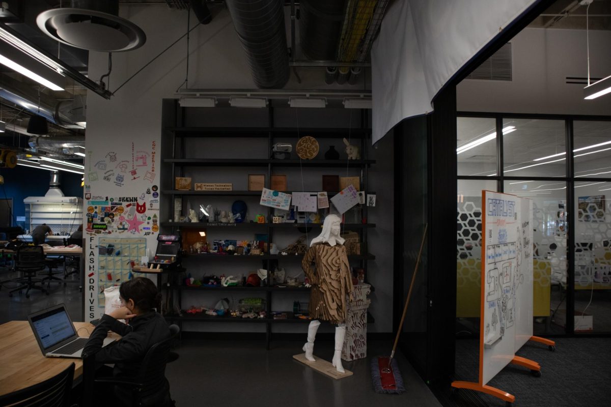 A wall of projects created by students lives at CATalyst Studios in the University of Arizona Library on Nov. 13. The works range from 3-D printed statues to woodcuts made on a CNC machine.
