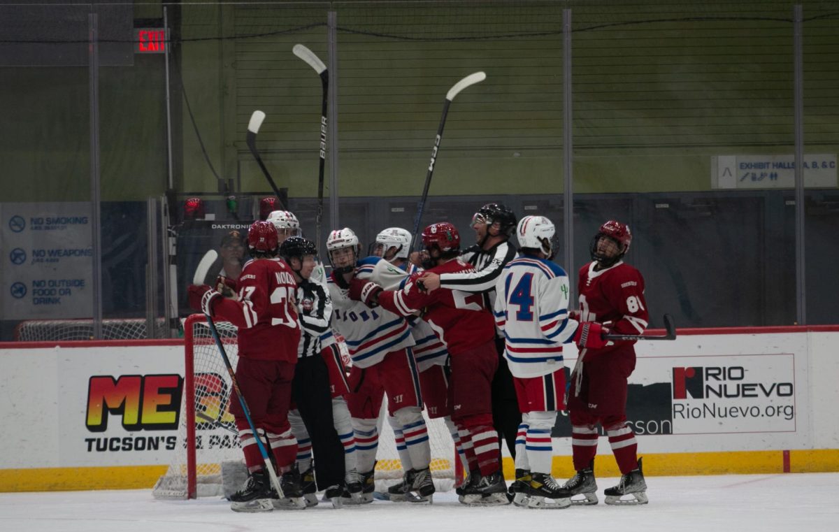 Sticks fly into the air as referees pull players apart during an Arizona hockey game against the University of Oklahoma in the Tucson Convention Center on Friday, Nov. 3. Though no fight materialized, tensions ran high between the players through the game. Arizona lost 3-2 in OT.