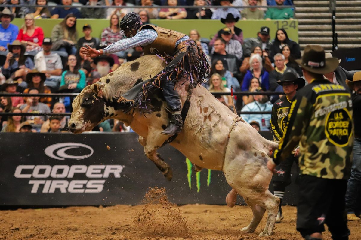 PBR rookie Kaiden Loud moves with the bull to stay on during the season opener of PBR Unleash the Beast at Tucson Arena on Nov. 11. Loud is one of the youngest riders on tour at just 18 years old.
