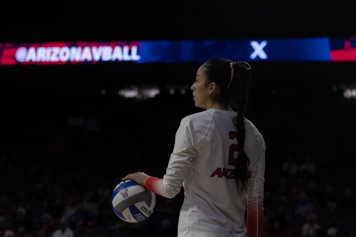 Arizona volleyball player Sofia Maldonado Diaz prepares to serve the ball against Utah on Nov. 9 in McKale Center. The Wildcats went on to win the game 3-1 against Utah.