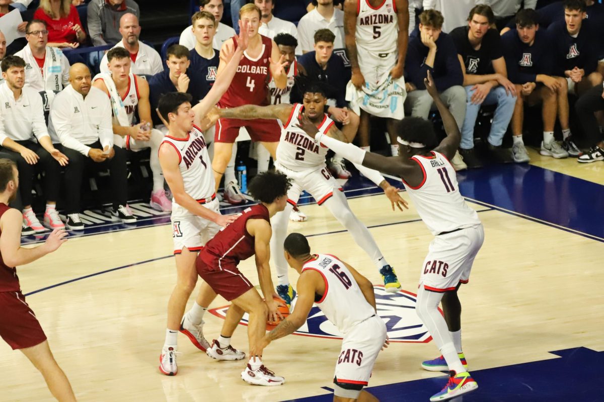 Arizonas defense circles Colgate as the game starts nearly even in scoring on Dec. 2 in McKale Center. Colgate finished the game with only one offensive rebound coming at the final buzzer.

