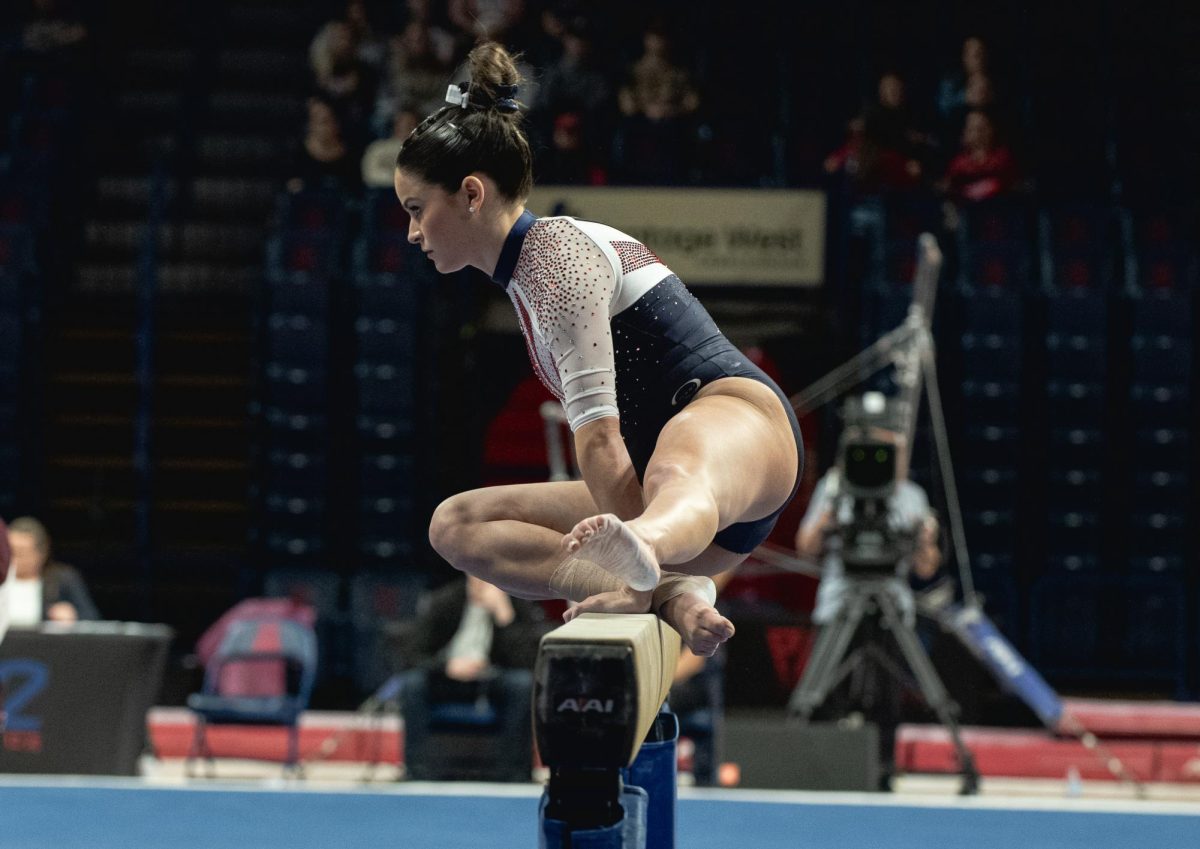 Caroline Herry performs on the balance beam in the gymnastics meet against Arizona State on Feb. 15 in McKale Center. Herry has had a career high of 9.900 on this event. 