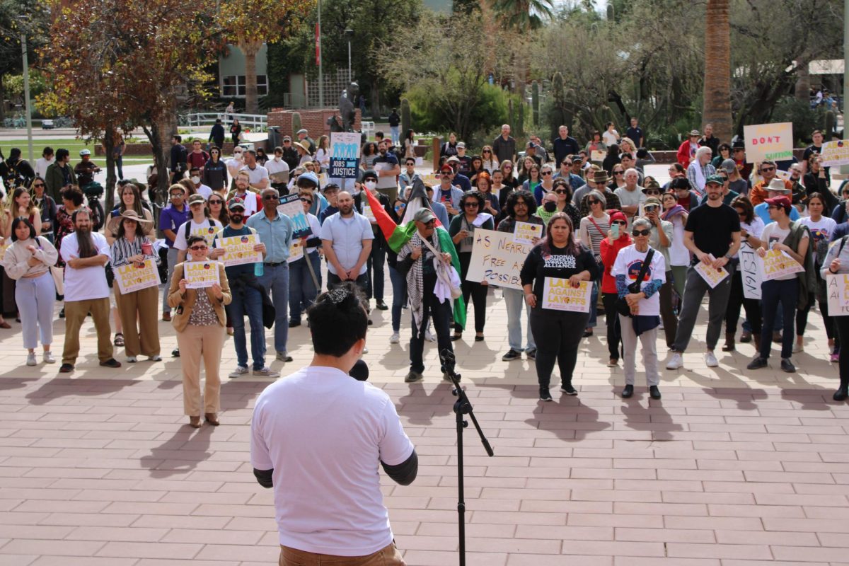 Marcos Esparza, a graduate student, faces the crowd to give a speech on Feb. 5 in front of the Administration building. United Campus Workers Arizona protested staff and faculty layoffs amidst the financial crisis. 