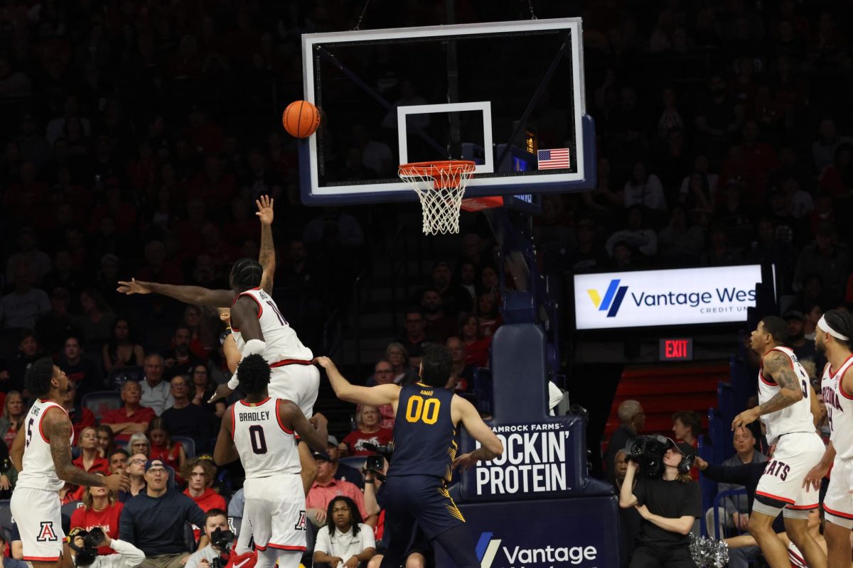 Arizona’s Oumar Ballo (11) tips off the game against UC Berkeley on Thursday, Feb 1st. The night ended with a steep 91-65 point win for the Wildcats.
