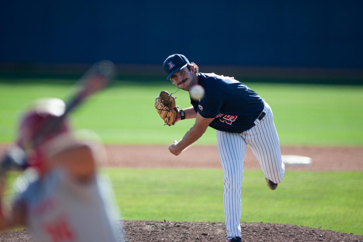 Sophomore Jaeden Swanberg pitches during the game against Utah Tech at Hi Corbett on Feb. 20. Wildcats took the win 24-4.
