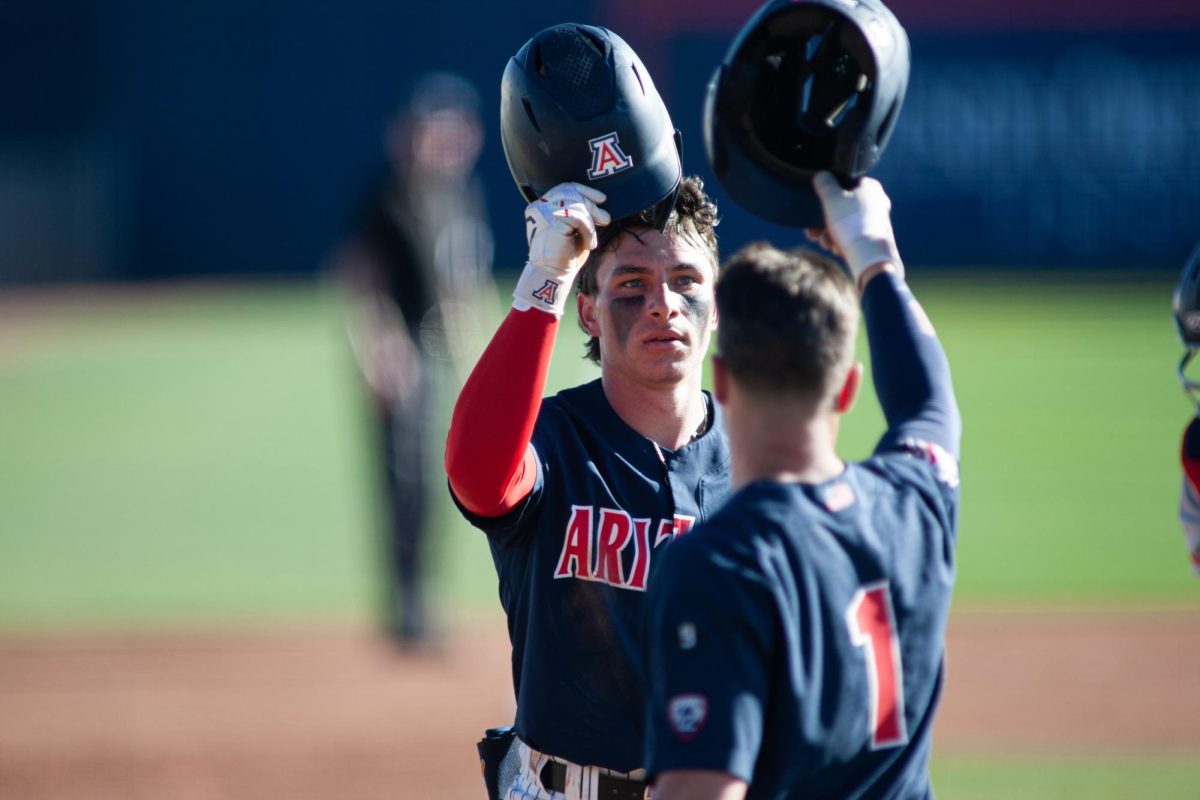 Junior Emilio Corona celebrates after hitting a home-run during a game against Utah Tech at Hi Corbett Tuesday Feb. 20. Wildcats took the win 24-4.
