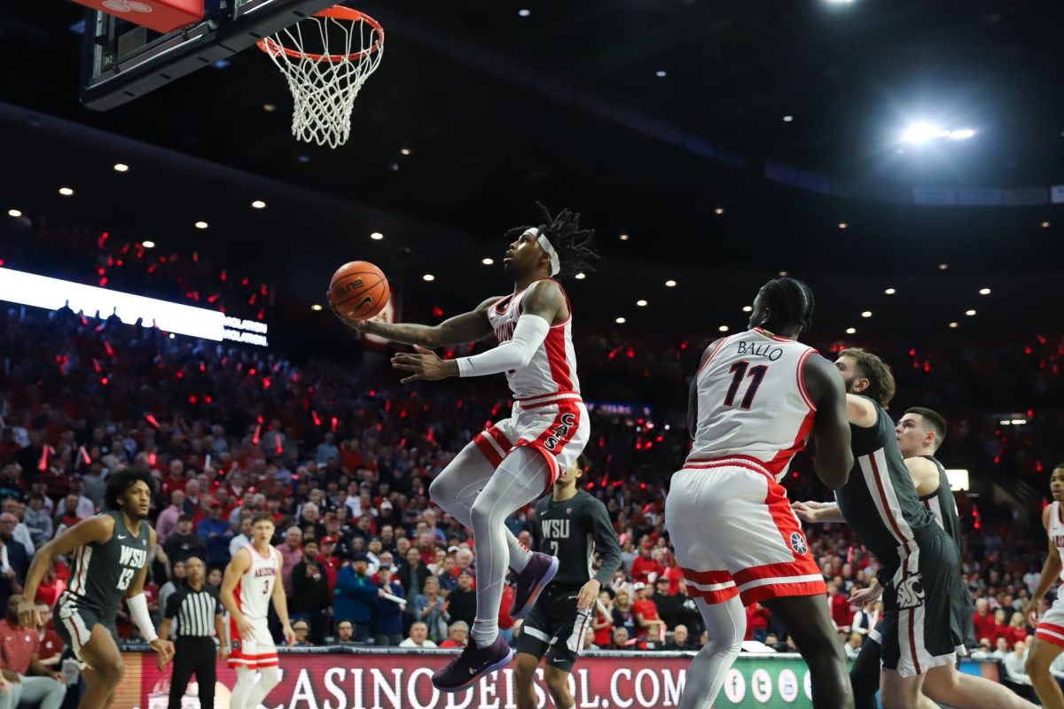 Caleb Love cuts to the basket early in the first half against Washington State in McKale Center on Feb. 22. Love led both teams in scoring with 27 points.