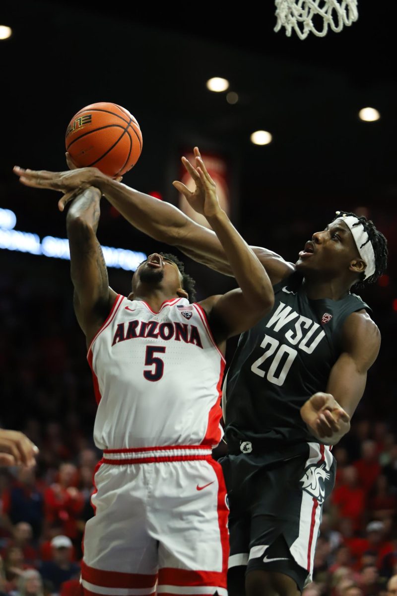 Arizonas K.J Lewis is fouled by Washington State as he drives towards the basket in McKale Center on Feb. 22. Lewis would only manage to get one free throw to drop.