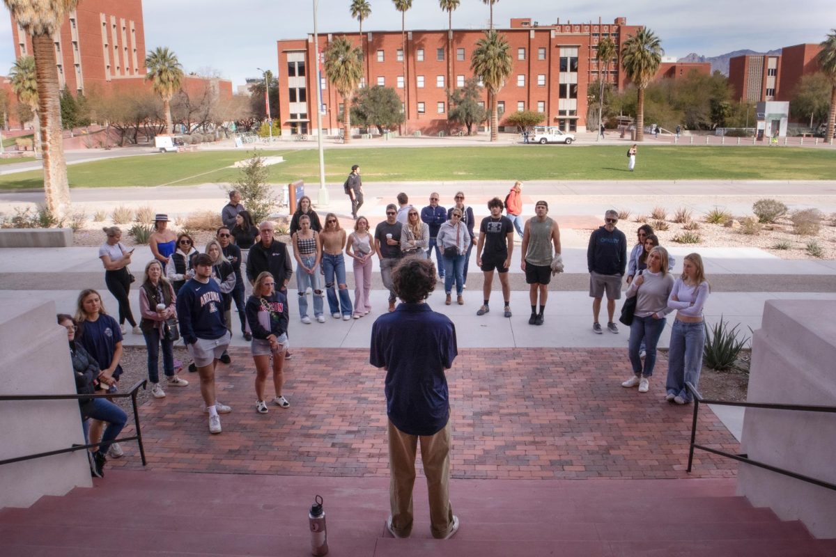 Adan Baca speaks to a tour outside the Bear Down Gym at the University of Arizona on Feb. 5. The tour takes prospective students and their parents all over the university’s campus.
