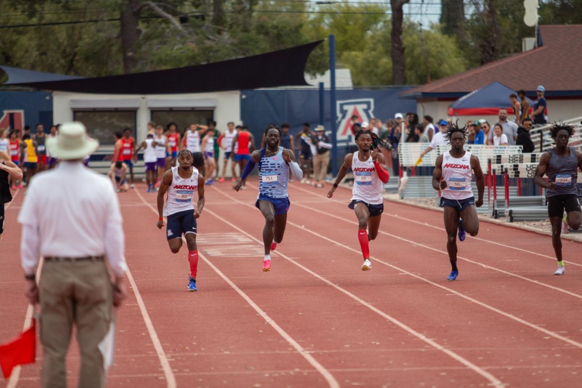 Trayvion White-Austin (left) and others run for Arizona in the mens 100 meter dash at Drachman Stadium on March 23. White-Austin broke the Arizona school record for the 100 meter dash, completing it in 10.14 seconds.

