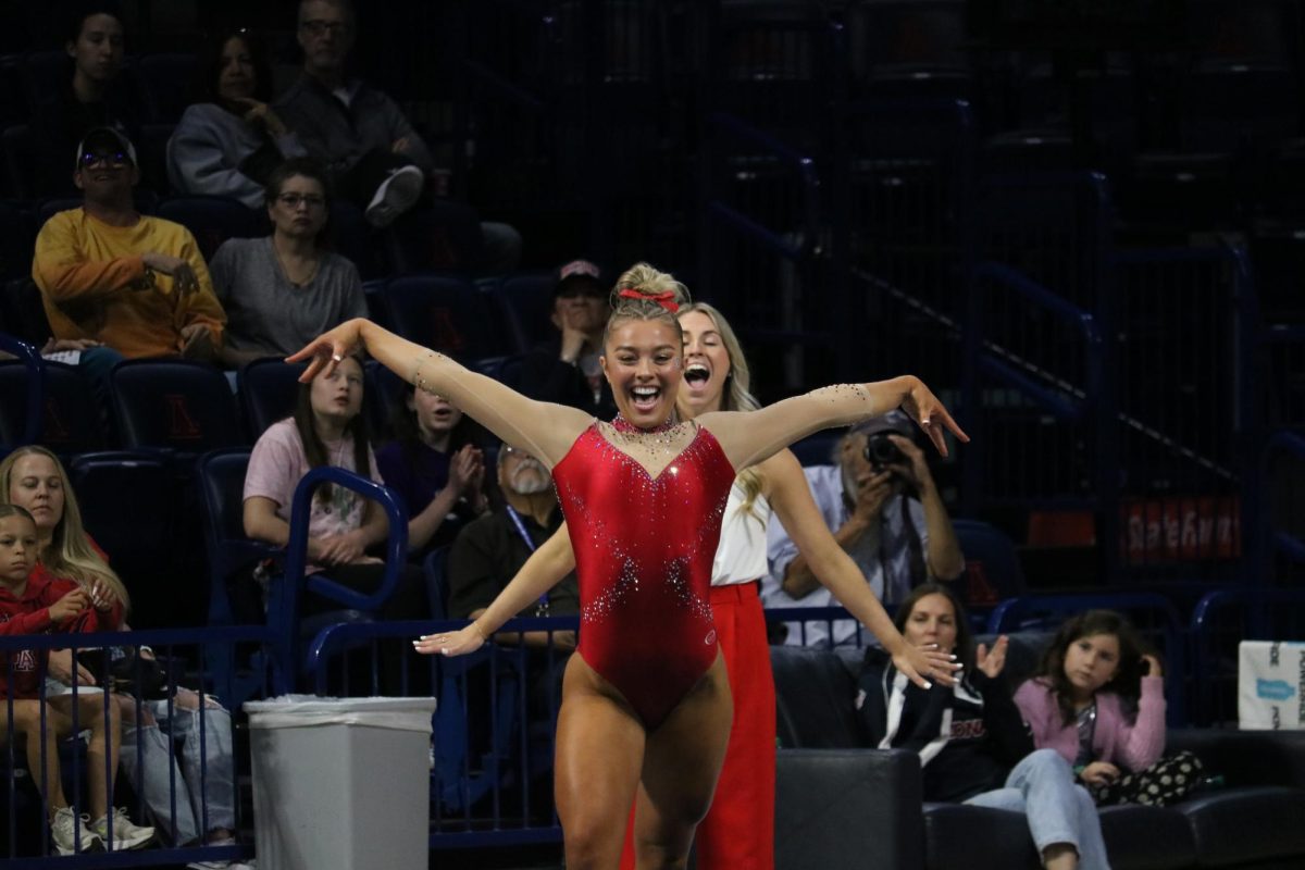 Emma Strom performs her floor routine against Southern Connecticut State in McKale Center on March 13. Strom averaged a 9.85 on her floor routine which was the highest floor score on the team.
