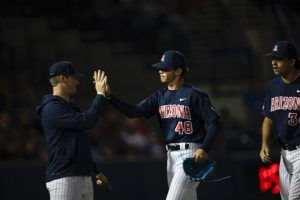 Brandon Zastrow is high-fived during the baseball game against GCU on March 19 at Hi Corbett Field. Zastrow gets high-fived for a successful inning of pitching. 