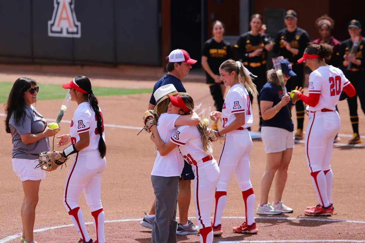 Senior Jasmine Perezchica hugs her mom after the ceremonial first pitch against ASU at Rita Hillenbrad Stadium on April 21. All four seniors caught their parents pitch as a part of the senior day festivities.