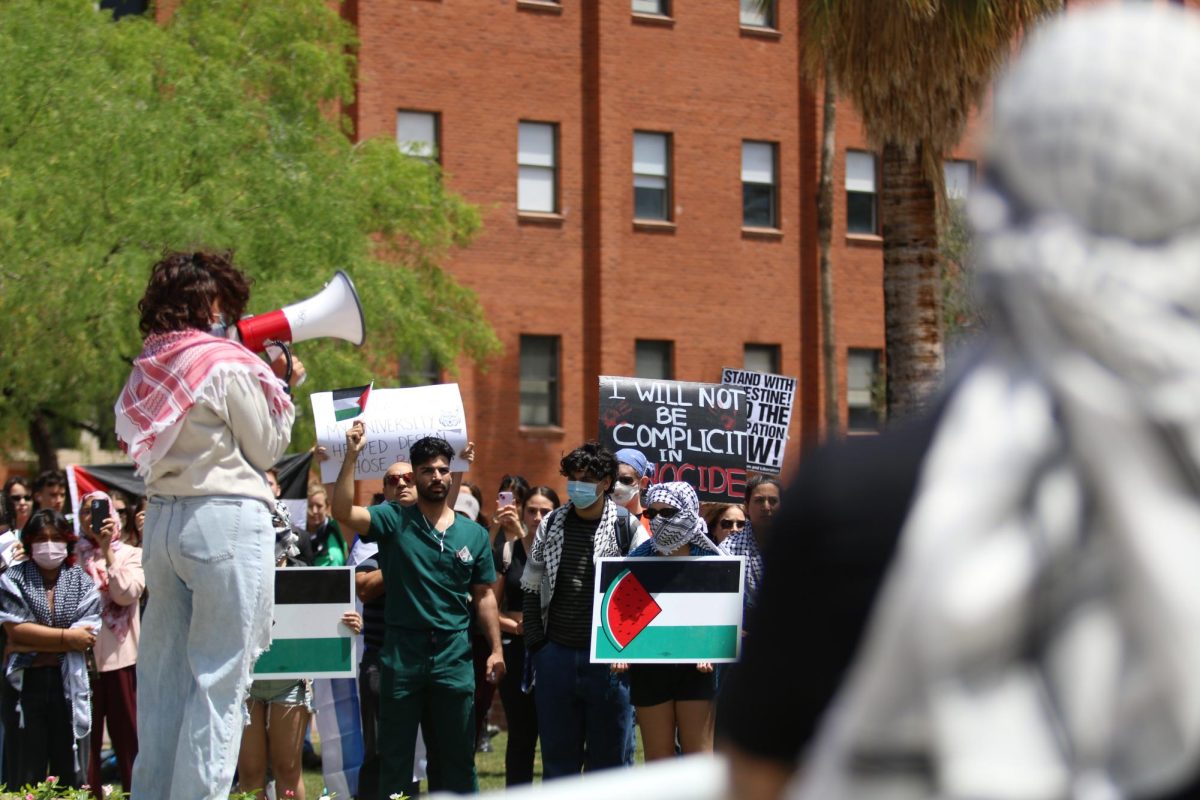 Protesters gather on the mall as a speaker presents on April 25. The protest supported Palestine during Israeli Apartheid Week.