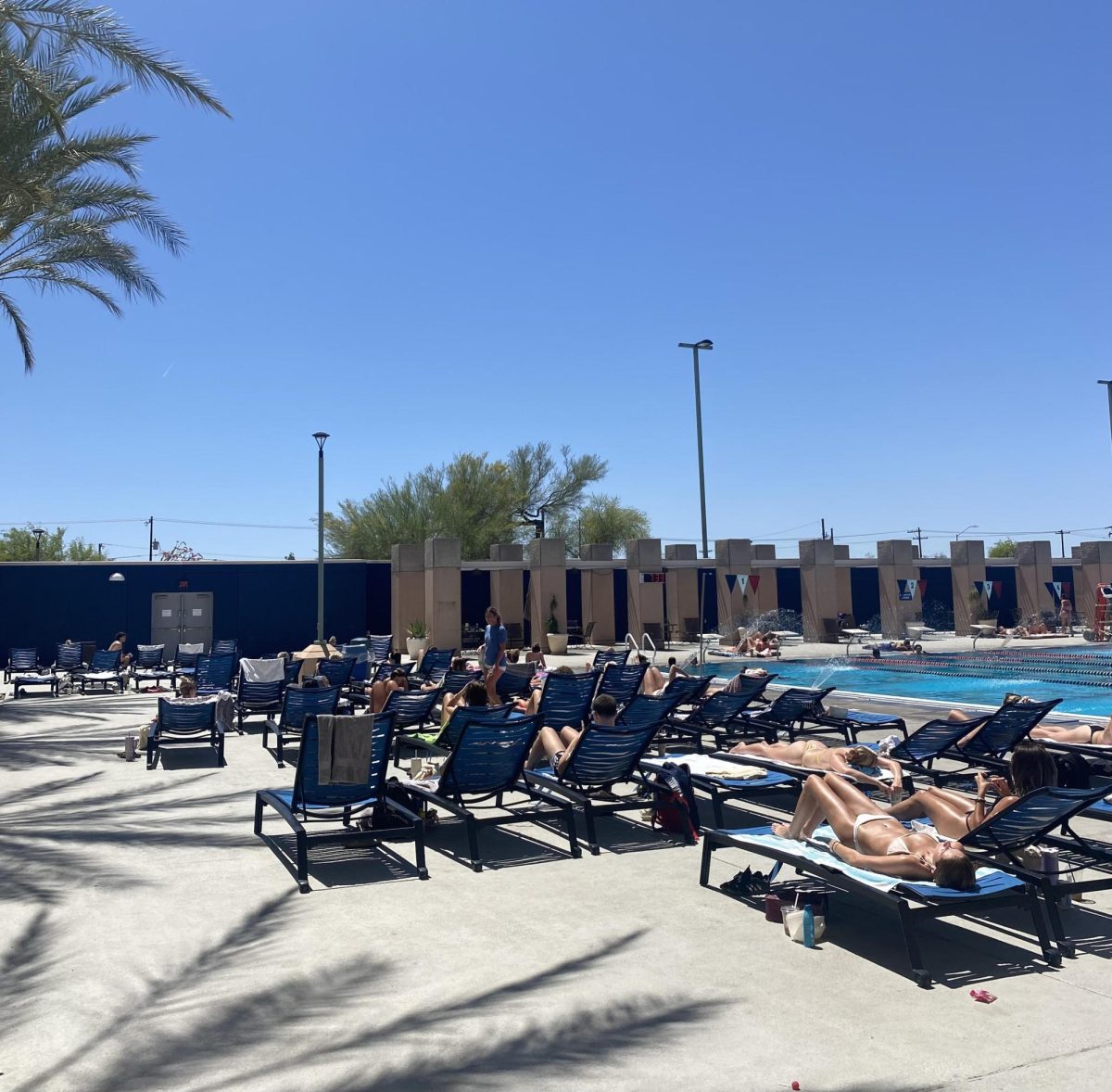UA students tan at the South Rec Center on a day with a UV Index of 10.