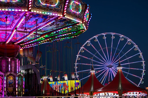 Iconic symbols of the fair, the Ferris wheel and swings, light up the night sky at the 2023 Pima County Fair. Visitors can expect the same attractions at this year’s event running from April 18-28. Photo courtesy of Pima County Fair.
