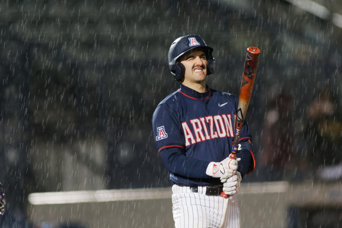 Blake McDonald up to bat as it starts raining during game against New Mexico State March 26th at Hi Corbett Field. Blake being on the top four game leaders bringing in one RBI to help in the Wildcats battle. Final score 9-12.