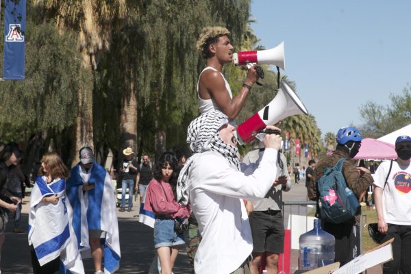 Harlow Parkin (front) and Asani Fowler (back) lead chants at a pro-Palestine protest on the UA Mall on April 29. Several counter protesters, as pictured in the back, were present around the encampment throughout the day.
