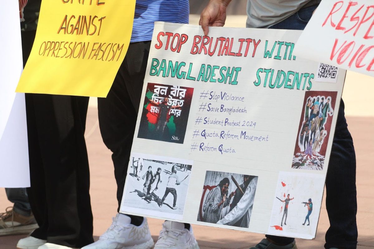 A protestor holds a poster during a chant on July 24. The poster calls to stop brutality with students.