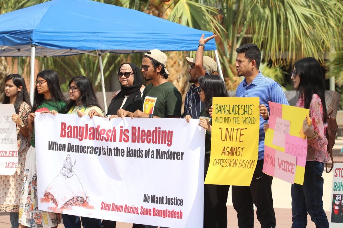 Md Abdur Rahman Apu leads a group of protesters in a chant on July 24. Apu is one of many protestors concerned for their family in Bangladesh.