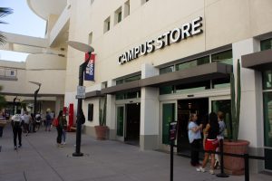 Students pass by the newly renovated University of Arizona Campus Store in between classes on Aug. 28. The Campus Store reopened to the public on Monday, Aug. 19.