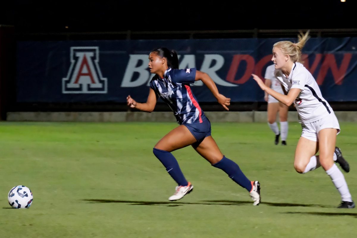 Zoe Mendiola charges down the field pursued by a Cincinnati player on Sept. 26 at Murphey Field at Mulcahy Stadium. The Wildcats scored two goals in the first half.