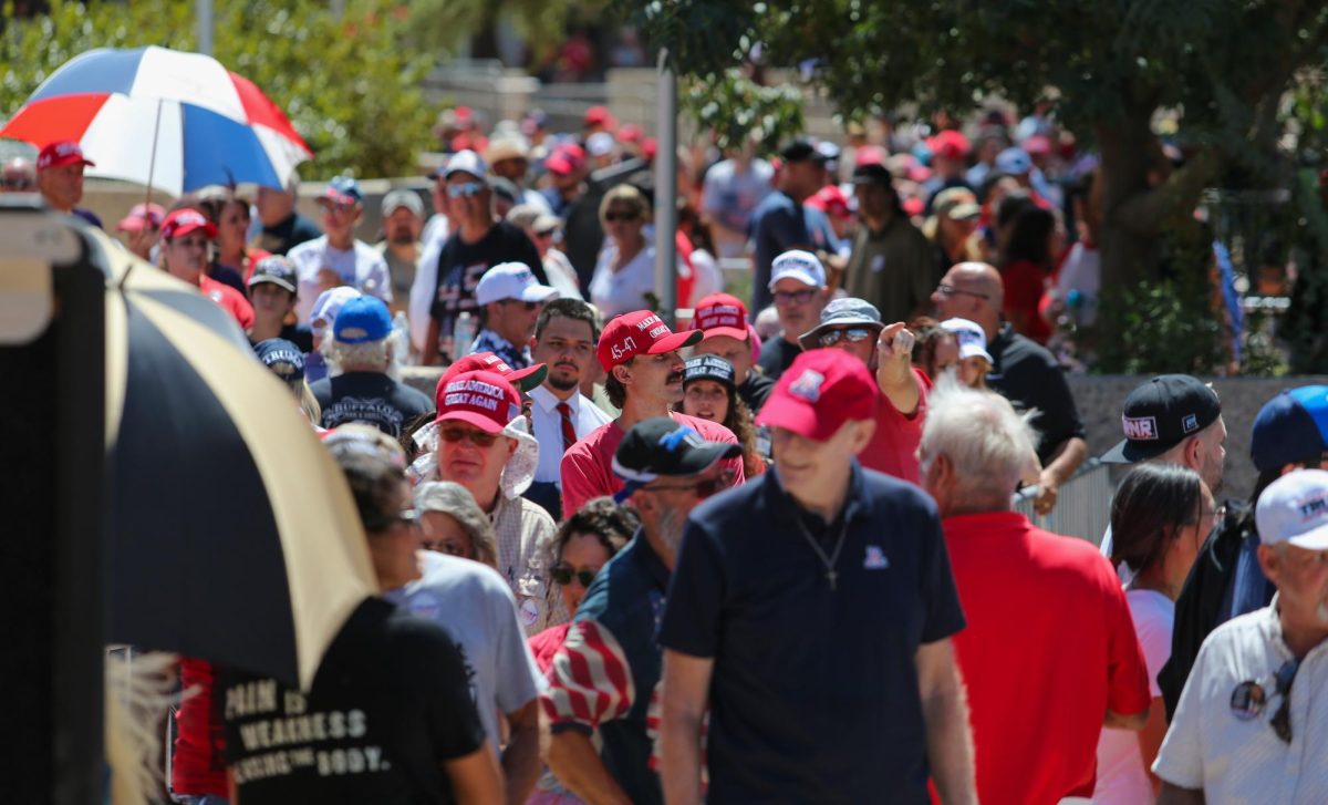 Trump supporters wrap around Linda Ronstadt Music Hall in Downtown Tucson hours before Former President Trump arrives for his rally on Sept. 12.  Supporters passed out from dehydration and heat exhaustion due to high temperatures.