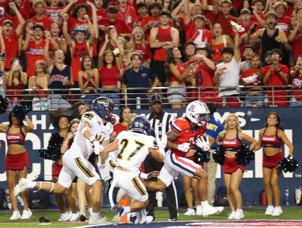 Jeremiah Patterson runs into the end zone in the beginning of the second half against Northern Arizona University on Sept. 7 at Arizona Stadium. This was only one of two touchdowns of the night by Arizona.