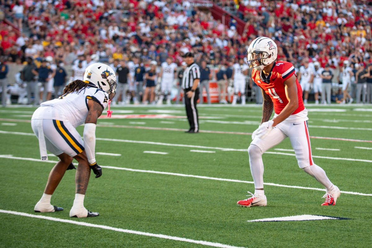 Tetairoa McMillan (#4) faces a West Virginia opponent on Oct. 26 at Arizona Stadium. McMillan is a Junior from from Waimanalo, Hawai'i.