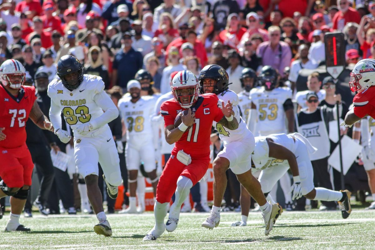 Noah Fifita scrambles after pressure in the pocket from the University of Colorado Boulder at home on Oct 19. Fifita ran for 71 rushing yards, a season high.