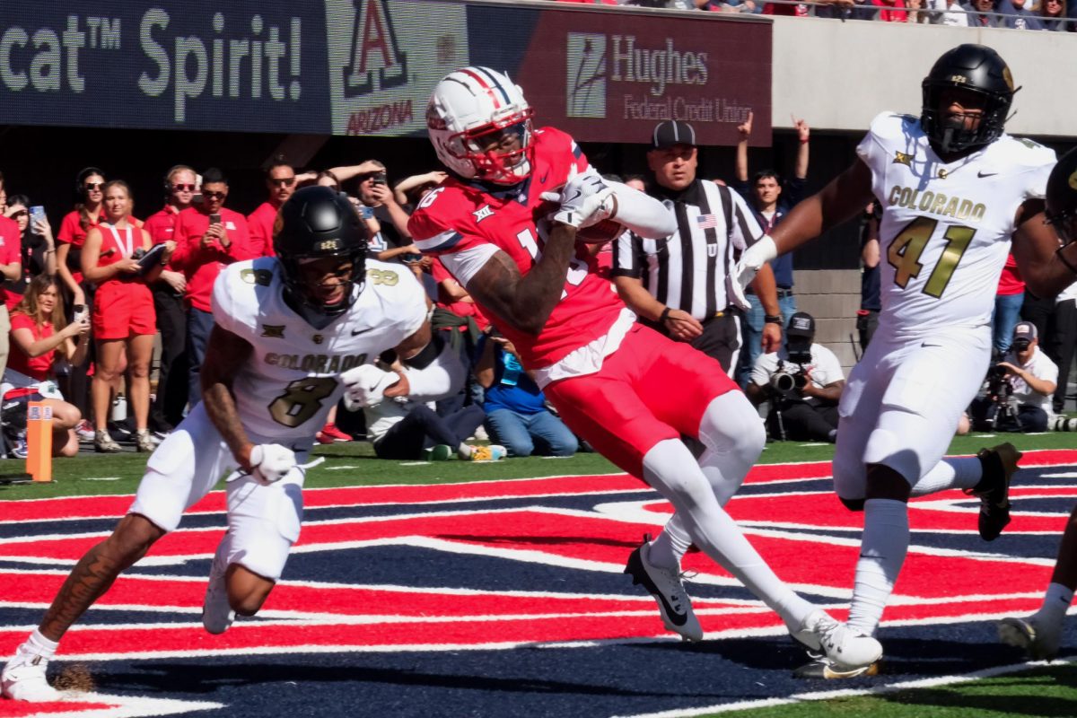 Arizona football wide receiver Chris Hunter spins into the end zone for Arizona’s only touchdown against the University of Colorado on Oct. 19. The Wildcats struggled in the first half against a powerful Colorado offense.