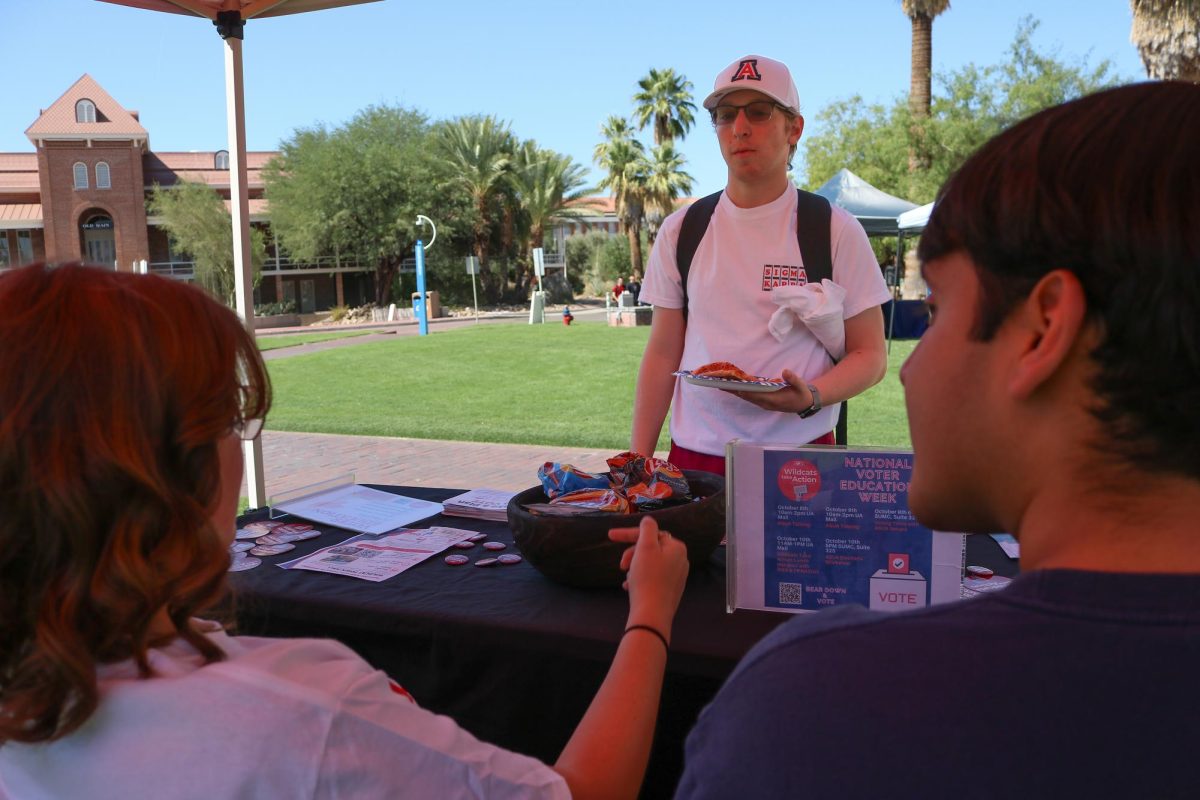 Ross Nemeth speaks with ASUA members about voting in Arizona on the UA Mall on Oct. 10. 