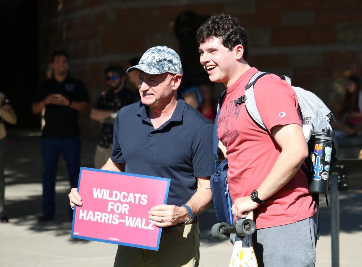 Senator Mark Kelly poses for a photo with a student on the UA Mall on Oct. 15. Later this week, former President Barack Obama is set to visit Tucson on the Harris-Walz campaign trail.