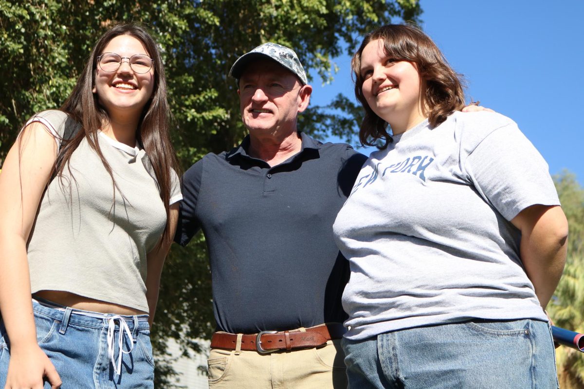 Students pose for a picture with Senator Mark Kelly on the UA Mall on Oct. 15. The U.S. Senator asked people where they were from and answered their questions during the meet-and-greet.