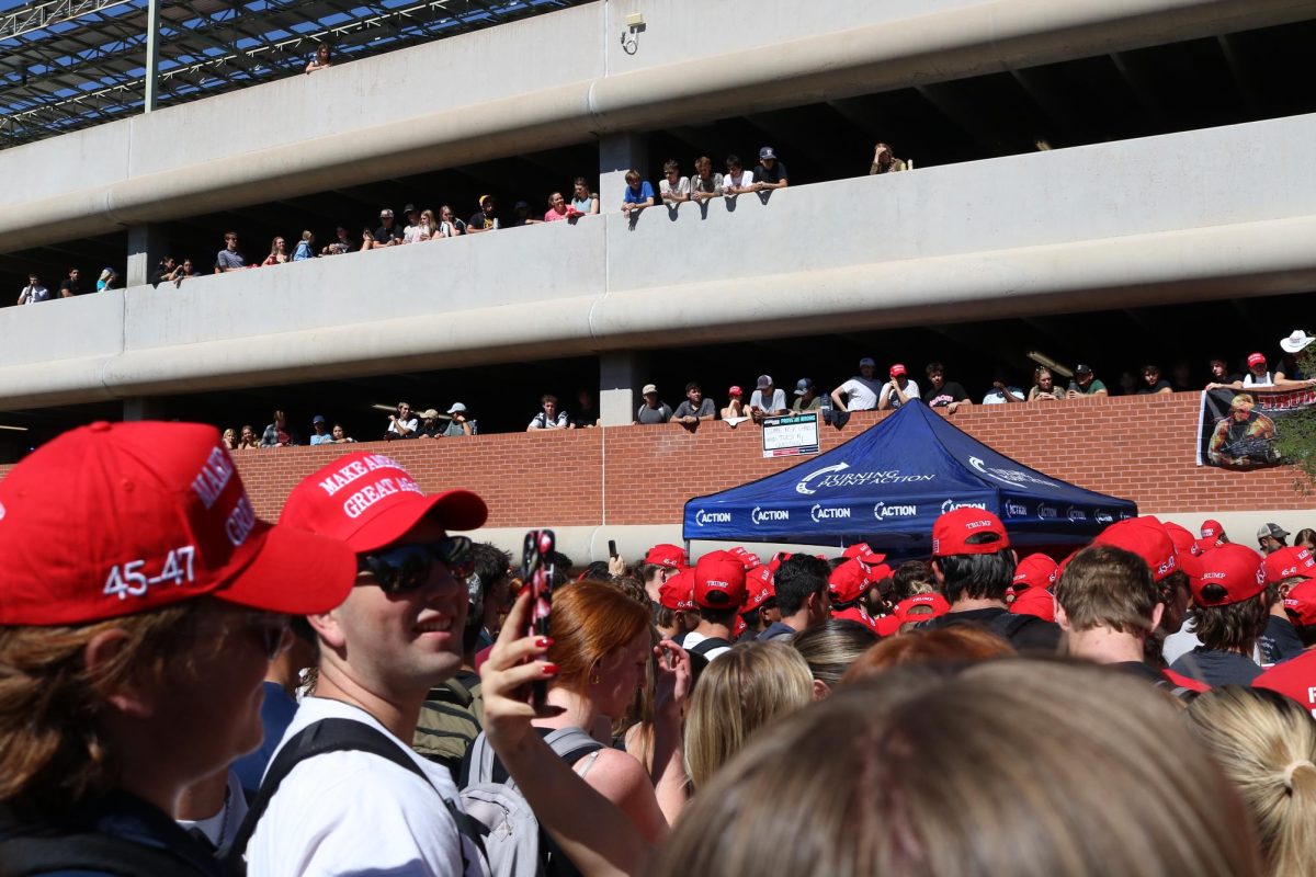 Students watch Charlie Kirk speak on the UA campus from 2nd Street Garage, the top of the union and on the ground on Oct. 16. Kirk will be hosting an event in the student union ballroom in addition to his "ask me anything."