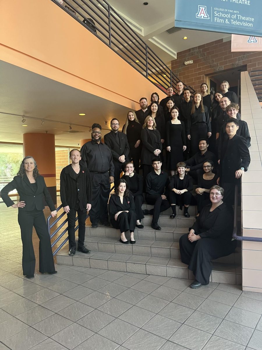 Elizabeth Schauer, left, and the 2024 UA Symphonic Choir stand on the stiars in the Tornabene Theater on campus. The choir will be performing at the Consulate of Mexico in Tucson on Nov. 1.(Courtesy UA School of Music)