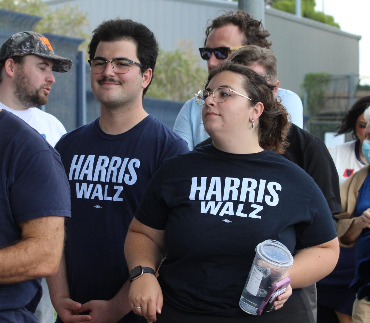 Two people sport Harris-Walz shirts at the Obama get-out-the-vote rally on Oct. 18. The rally was at the Cole and jeannie Davis sports center, where doors opened at 2 p.m.