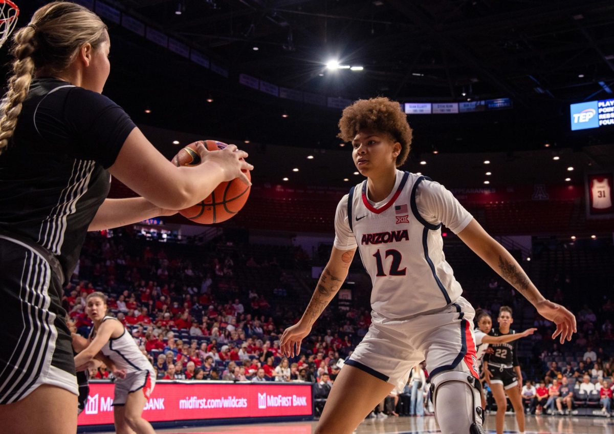 Montaya Dew playing defense on Oct 25 against West Texas A&M in McKale Center. Dew's position is forward.