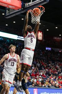 KJ Lewis dunks the ball against Canisus on Nov. 4 in McKale Center. Lewis was one of three Wildcats in double digit scoring.